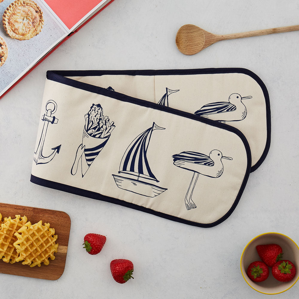 Double oven glove featuring nautical design in navy and eggshell, Double kitchen oven glove featuring nautical design in navy, Nautical oven glove featuring designs such as a sailboat and seagull