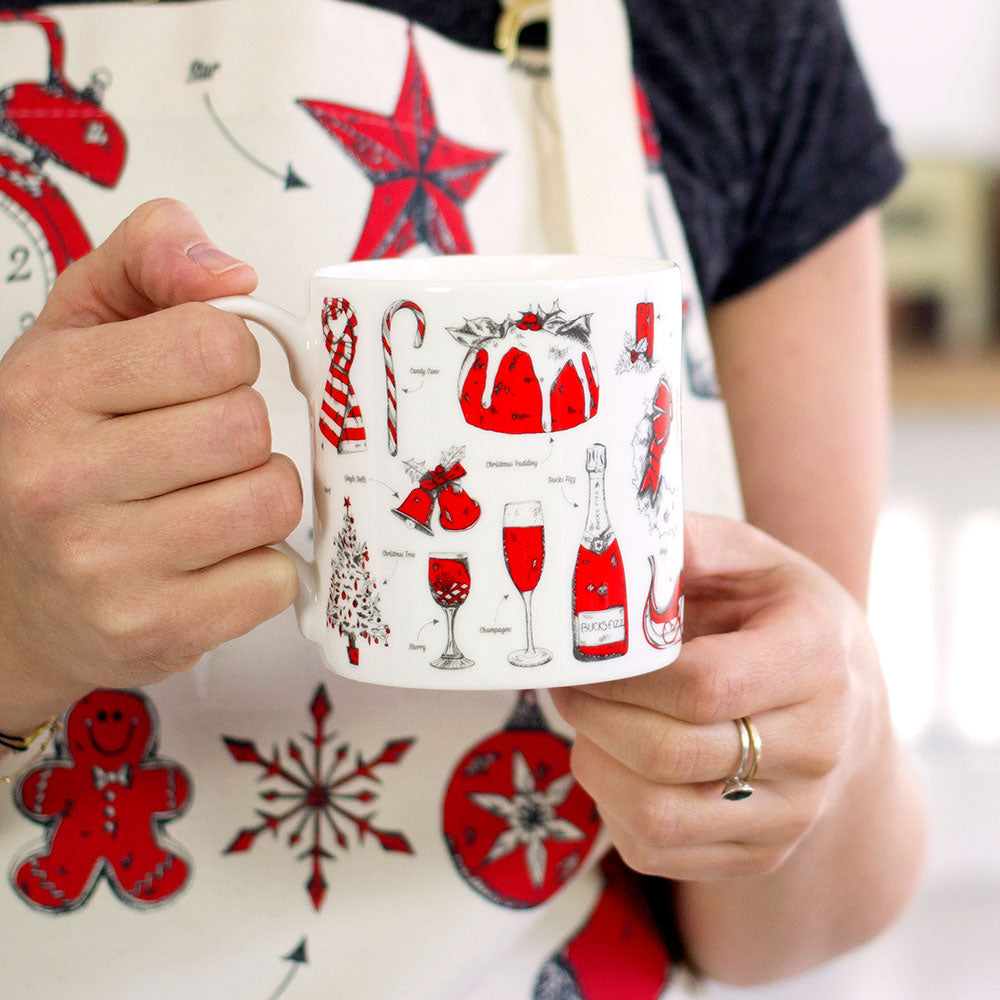 Fine bone china Christmas mug featuring repeating Christmas icon design, Fine china Christmas mug featuring various Christmas icons such as snowflakes and Santa's sleigh, Hand illustrated Christmas designs printed on fine bone china mug, Red and charcoal 
