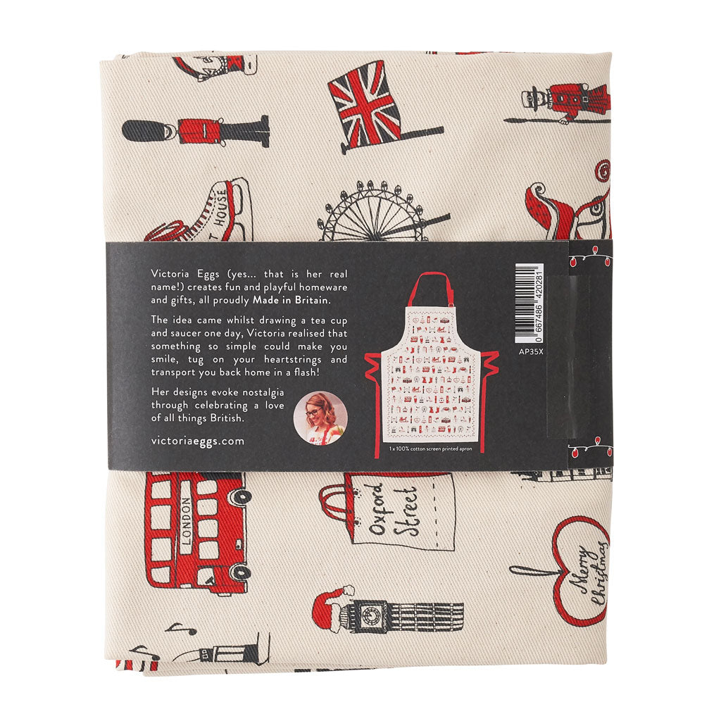 Adult's Christmas apron featuring various London Christmas icons, Red strapped London icons Christmas apron, Hand illustrated Christmas apron, Cotton Christmas apron featuring iconic London Christmas favorites, Christmas apron with repeating London Christ