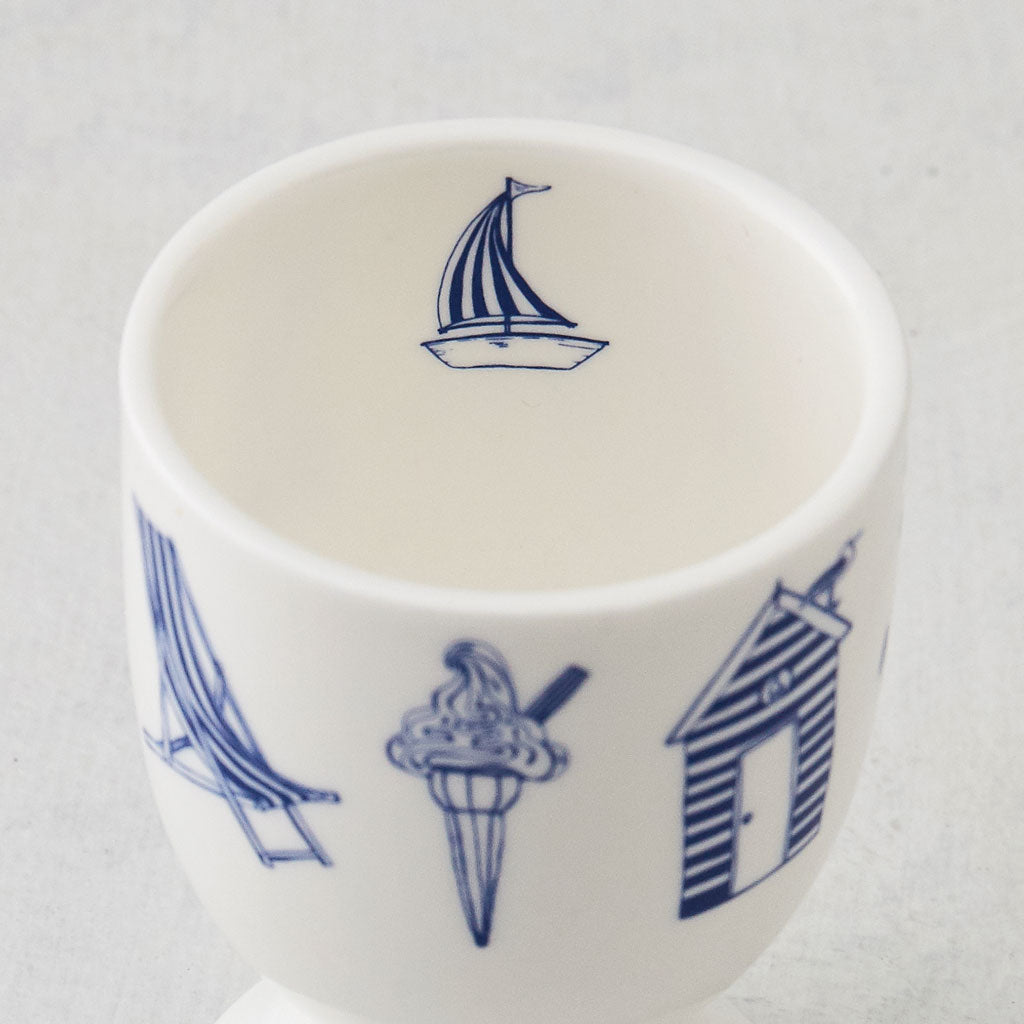 Nautical design egg cups featuring repeating pattern of navy nautical icons, Fine bone china egg cups featuring repeating nautical design, Navy and white nautical egg cups featuring hand illustrated nautical icons