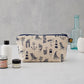 Cosmetic bag featuring repeating nautical design in navy, Pencil case featuring nautical design of repeating beachscape icons, Small nautical travel bag featuring repeating design of iconic nautical designs in navy